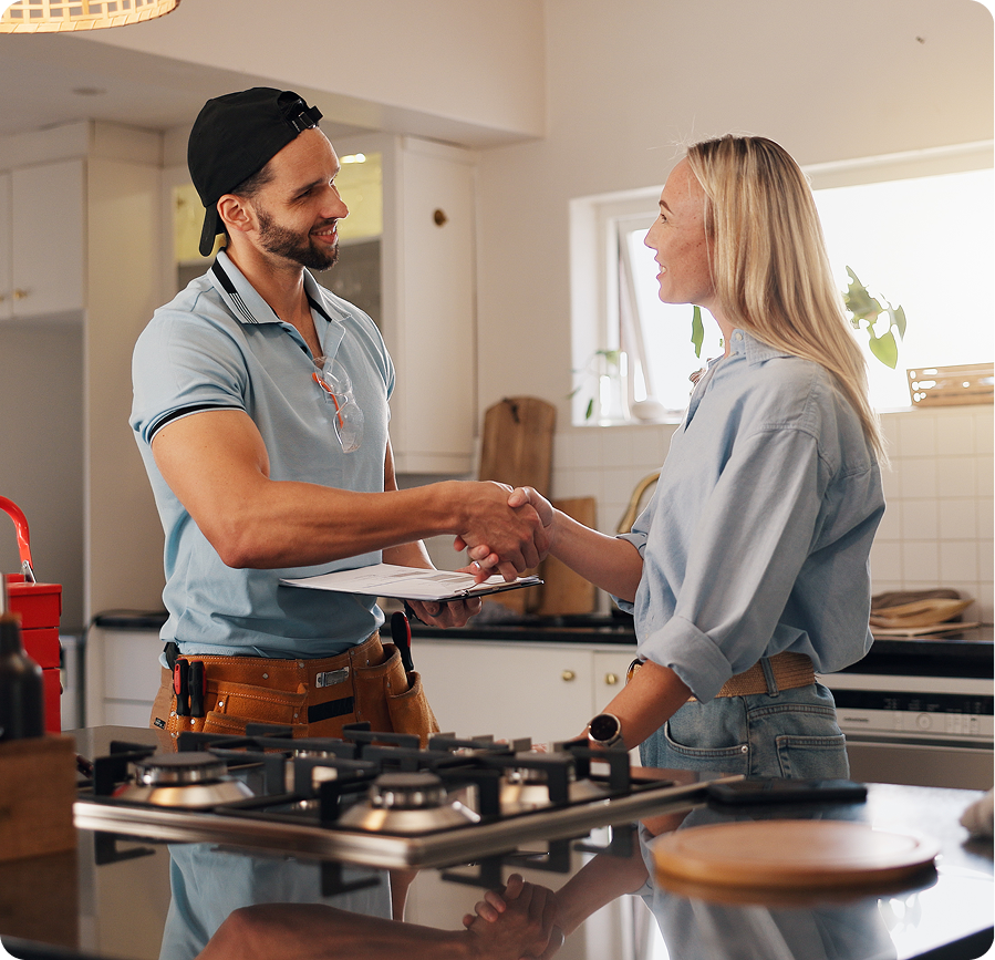 Contractor meeting with homeowner in bright kitchen