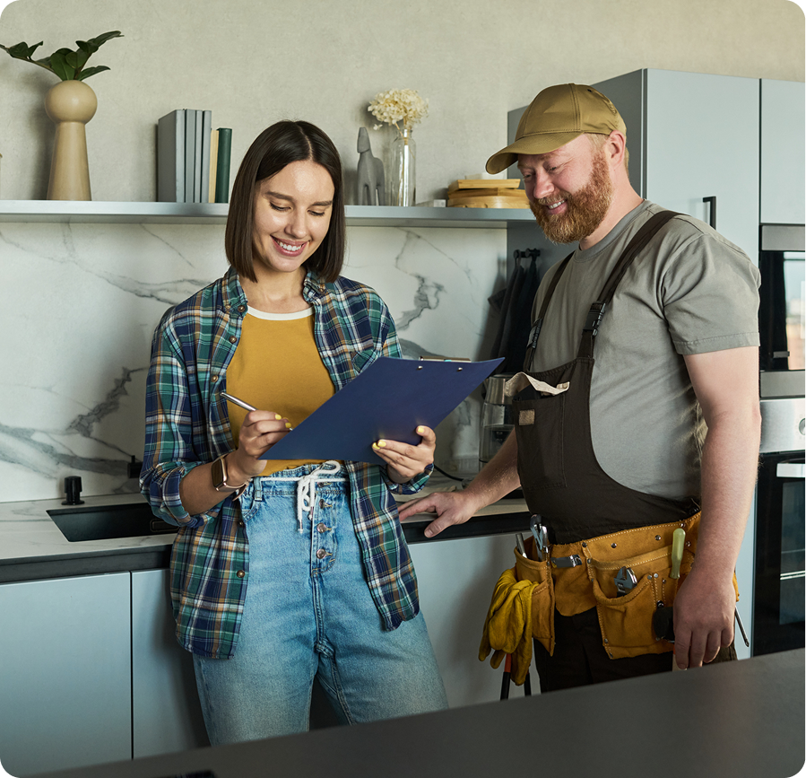 Contractor meeting with homeowner in bright kitchen