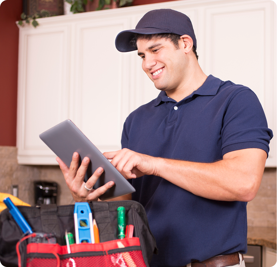 Worker using tablet in kitchen