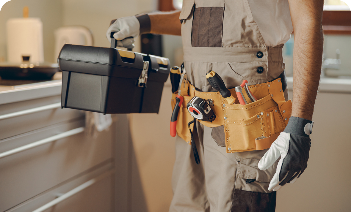 Handyman with tool belt and toolbox